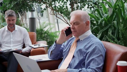 business man using a smartphone to clarify the necessary information.