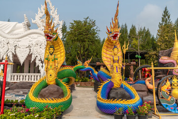 Fototapeta premium The King Serpent and Queen Serpent statue at Wat Don Khanak, Nakhon Pathom, Thailand