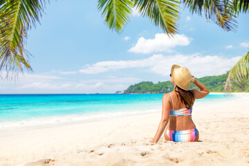 Woman lying on the sea beach