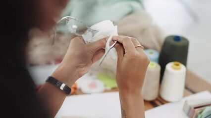 Woman hands cleaning glasses, lens and eye care protection with tissue in creative office. Female, cloth and wipe spectacle frames eyewear for clear vision, maintenance and dust for fashion designer