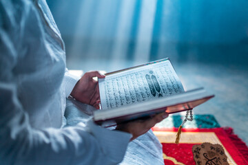 Muslim person with Quran, Ramadan Month praying concept image