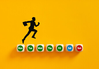 Fototapeta na wymiar Silhouette of a businessman running on days of week on wooden cubes to reach the weekend holiday.
