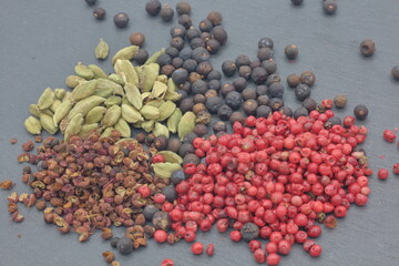 Spices for gin tonic on dark slate
