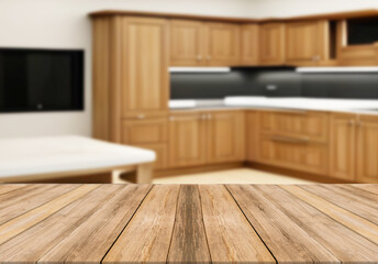 Wooden board empty table blurred background wooden kitchen. 

