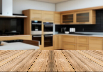 Wooden board empty table blurred background wooden kitchen. 

