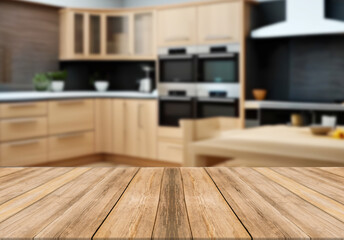 Wooden board empty table blurred background wooden kitchen. 
