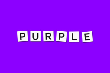 The word PURPLE, spelt with letter Scrabble tiles on a purple background