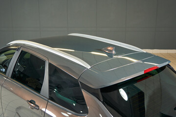 pearl gray car roof with roof rails and air divider fin