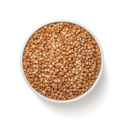 Bowl of buckwheat isolated on white background. Straight top view