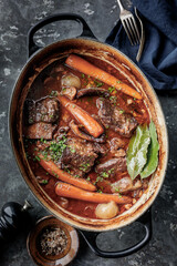 Boeuf bourguignon, tradition beef stew cooked in red wine with onions carrots and mushrooms 