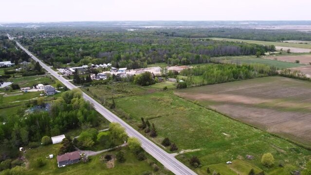 Aerial shot flying over rural East Gwillimbury, Ontario on an overcast day.