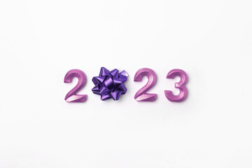 2023 Purple Numbers on White Table. Modern New Year Background. Creative Greeting Card. Flat Lay, Top View, Copy Space. Banner Design. Minimal Festive Mock Up with Numbers. Time to Celebrate Holiday
