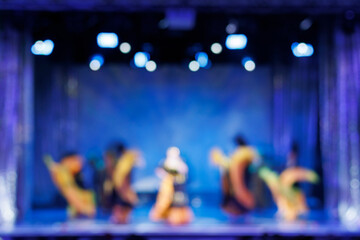 Texture blur and defocus. Stage color light at a concert show. Artists perform on scene in light...
