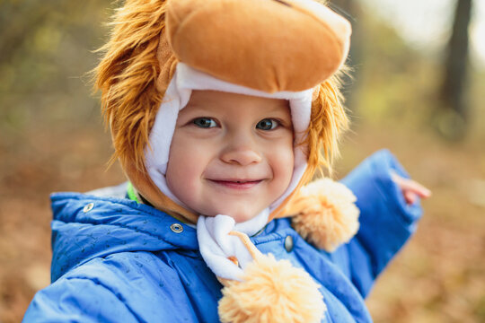 Smiling cute boy wearing lion hat