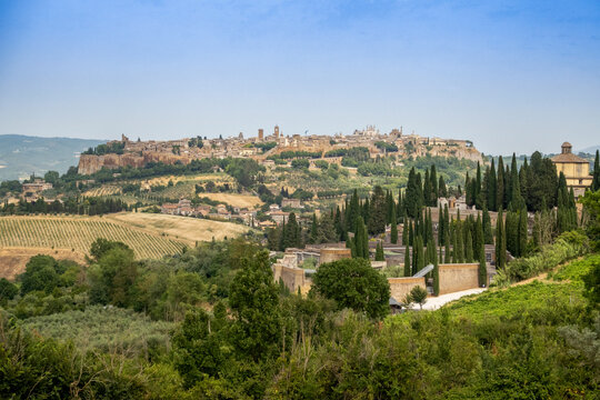 City on hill under blue sky at sunny day, Orvieto, Italy