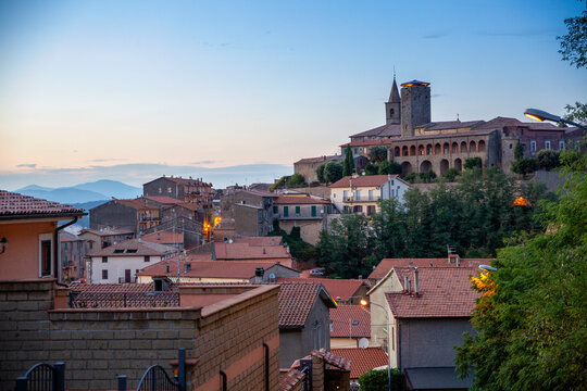 Buildings in Valentano under sky at sunset