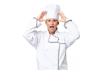 Middle-aged chef woman over isolated background with surprise expression