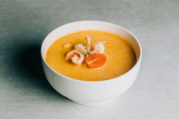 Spicy sea soup with calmari and tomatoes