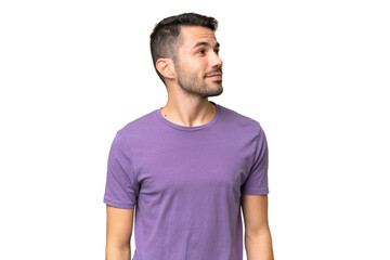 Obraz premium Young handsome caucasian man over isolated background looking to the side