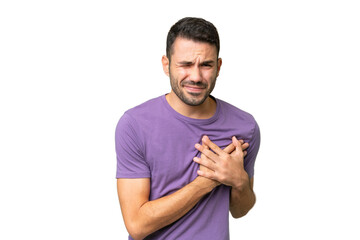 Young handsome caucasian man over isolated background having a pain in the heart