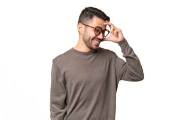 Young handsome caucasian man over isolated background laughing