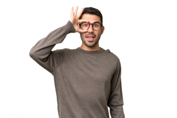 Young handsome caucasian man over isolated background showing ok sign with fingers