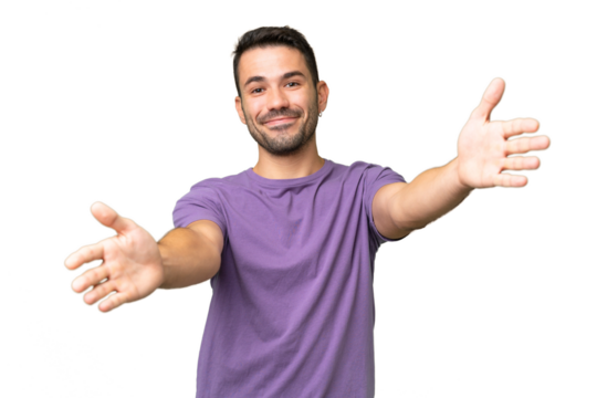 Young handsome caucasian man over isolated background presenting and inviting to come with hand