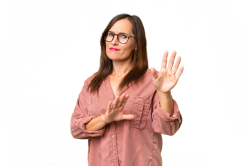 Middle-aged caucasian woman over isolated background nervous stretching hands to the front