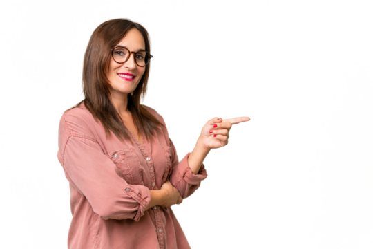 Middle-aged caucasian woman over isolated background pointing finger to the side