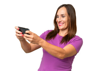 Middle-aged caucasian woman over isolated background playing with the mobile phone