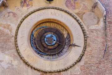 Old clock on the clock tower, in Mantua