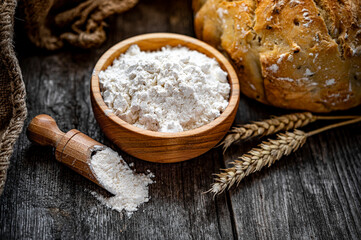 Wheat flour on an old wooden table