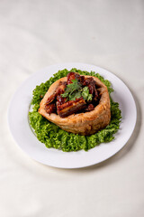 popular special wok fried sweet and sour pork ribs with deep fried yam ring on white wood table asian chinese banquet meat menu for restaurant 