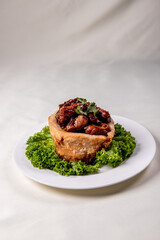 popular special wok fried sweet and sour pork ribs with deep fried yam ring on white wood table asian chinese banquet meat menu for restaurant 