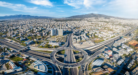 Aerial drone panoramic view of multilevel junction ring road as seen in Attiki Odos toll road motorway interchange with Kifisias Avenue in Marousi Attica, Athens, Greece