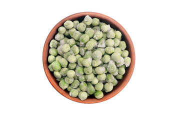 Frozen green peas in a clay bowl on a white background