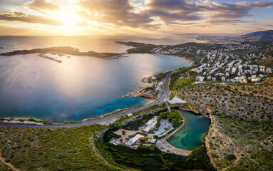Aerial view of the Vouliagmeni district in south Athens, Greece, with the lake and Asteras peninsula during sunset time