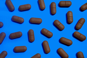 Some pills, dietary supplements or vitamin capsules for supports health.