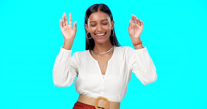 Happy woman, face and dance of freedom on blue background, studio backdrop and party celebration. Dancing, portrait and excited indian model celebrate happiness, smile and snap fingers for fun music