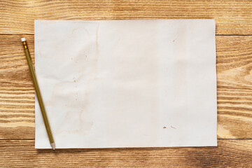 Sheet of paper lying on wooden table