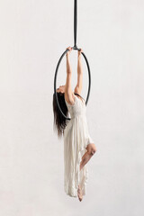 Woman hanging on aerial hoop © photology1971