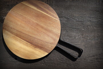 Food background. Cutting board on dark wooden table. Copy space