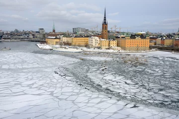Fotobehang Riddarholmen and frozen lake, Stockholm, Sweden © Jerry