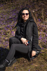Beautiful smiling woman in the early spring park