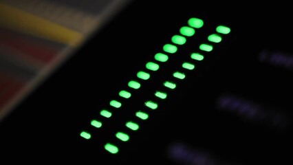Work of general audio signal level indicator on mixing console desk at radio studio. Electronic panel for DJ engineer. Device for record adjusting sound at night club during concert