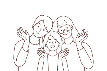 Smiling three generations of women posing together 