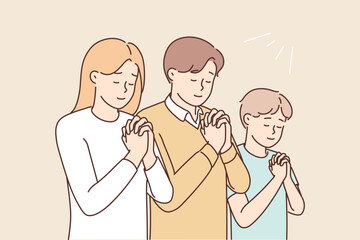 Religious family with child praying 