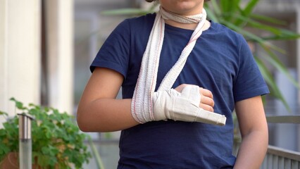 boy child 8 years old child breaks by fracturing the finger of his right hand and wears a rigid...