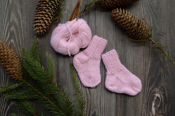 Small and soft baby socks made of pink cotton yarn 