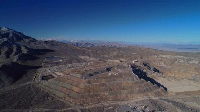 Tracktors is working on mountain of quarry in California. Quarry excavations.